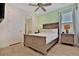 Bright bedroom with a wooden bed frame and neutral color palette at 8049 Lost Shaker Ln, Kissimmee, FL 34747