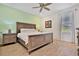 Bedroom with king-size bed and light wood frame at 8049 Lost Shaker Ln, Kissimmee, FL 34747