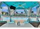 Private cabana with pool view, TV, and ceiling fan at 8049 Lost Shaker Ln, Kissimmee, FL 34747