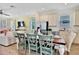 Farmhouse style dining table with six chairs, adjacent to kitchen at 8049 Lost Shaker Ln, Kissimmee, FL 34747