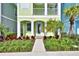 Inviting house exterior with a light green facade and walkway at 8049 Lost Shaker Ln, Kissimmee, FL 34747
