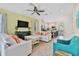 Open living room with light colored sofas and a view of the kitchen at 8049 Lost Shaker Ln, Kissimmee, FL 34747