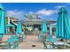 Relaxing pool bar with turquoise seating and umbrellas at 8049 Lost Shaker Ln, Kissimmee, FL 34747