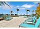 White sand pool deck with many lounge chairs at 8049 Lost Shaker Ln, Kissimmee, FL 34747