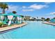 Large resort-style pool with cabanas and lounge chairs at 8049 Lost Shaker Ln, Kissimmee, FL 34747