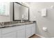 Clean bathroom with granite vanity and a large mirror at 8558 Crystal Cove Loop, Kissimmee, FL 34747