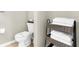 Bathroom with toilet and stacked towels at 8558 Crystal Cove Loop, Kissimmee, FL 34747
