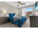 Comfortable bedroom with a queen bed and private balcony access at 8558 Crystal Cove Loop, Kissimmee, FL 34747