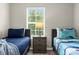 Bedroom with twin beds and nightstand at 8558 Crystal Cove Loop, Kissimmee, FL 34747