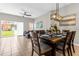 Bright dining area with a wooden table and access to the backyard at 8558 Crystal Cove Loop, Kissimmee, FL 34747