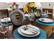 Elegant dining room showcasing a beautifully set table with place settings and centerpiece at 8558 Crystal Cove Loop, Kissimmee, FL 34747