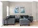Spacious living room featuring a comfortable sectional sofa at 8558 Crystal Cove Loop, Kissimmee, FL 34747