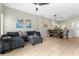 Open living and dining area with tile floors and ceiling fan at 8558 Crystal Cove Loop, Kissimmee, FL 34747
