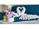 Main bedroom with towels folded into swans on the bed at 8558 Crystal Cove Loop, Kissimmee, FL 34747