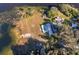 Aerial view of property showing house, pool, and lakefront location at 9000 Ogilvie Dr, Orlando, FL 32819