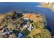 Aerial view of property showcasing lakefront location and pool at 9000 Ogilvie Dr, Orlando, FL 32819