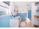 Clean bathroom with light blue tiled walls at 9000 Ogilvie Dr, Orlando, FL 32819