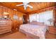 Cozy bedroom with wood walls and a comfortable bed at 9000 Ogilvie Dr, Orlando, FL 32819