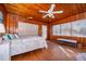 Charming bedroom with wood walls and a queen-size bed at 9000 Ogilvie Dr, Orlando, FL 32819