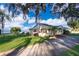 Ranch style home with lake view, mature trees, and spacious yard at 9000 Ogilvie Dr, Orlando, FL 32819