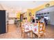 Large kitchen with white cabinets and a dining area at 9000 Ogilvie Dr, Orlando, FL 32819