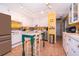 Bright kitchen with white cabinets and a kitchen island at 9000 Ogilvie Dr, Orlando, FL 32819