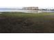 Picturesque lakefront property with distant buildings at 9000 Ogilvie Dr, Orlando, FL 32819
