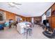Spacious living area with wood walls and a comfy sofa at 9000 Ogilvie Dr, Orlando, FL 32819