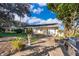 Spacious patio with grill and seating area near the house at 9000 Ogilvie Dr, Orlando, FL 32819
