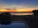 Sunset view of the lake from the pool area at 9000 Ogilvie Dr, Orlando, FL 32819