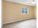 Spacious bedroom with a window, wood-look floors, and ceiling fan at 10125 Shadow Leaf Ct, Orlando, FL 32825