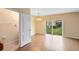 Spacious dining room with hardwood floors and sliding glass doors at 10125 Shadow Leaf Ct, Orlando, FL 32825