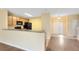 Open kitchen features a breakfast bar and modern black appliances at 10125 Shadow Leaf Ct, Orlando, FL 32825