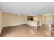 Spacious living area with hardwood floors and a view into the kitchen at 10125 Shadow Leaf Ct, Orlando, FL 32825