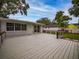 Spacious back deck with modern railings, overlooking a grassy yard at 105 N Hillside Ave, Orlando, FL 32803