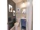 Modern bathroom with blue vanity and black accent wall at 105 N Hillside Ave, Orlando, FL 32803