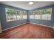 Well-lit bedroom with hardwood floors and large windows at 105 N Hillside Ave, Orlando, FL 32803