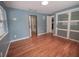 Bright bedroom with hardwood floors and access to bathroom at 105 N Hillside Ave, Orlando, FL 32803