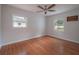 Well-lit bedroom, featuring hardwood floors and two windows at 105 N Hillside Ave, Orlando, FL 32803