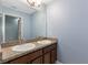 Bathroom with double sinks, granite countertop at 11113 Scenic Vista Dr, Clermont, FL 34711