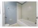 Clean bathroom with a tub and light blue walls at 11113 Scenic Vista Dr, Clermont, FL 34711