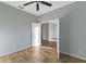 Spacious bedroom with tile floors and access to hallway at 11113 Scenic Vista Dr, Clermont, FL 34711