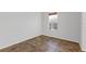 Simple bedroom with tile floors and a window at 11113 Scenic Vista Dr, Clermont, FL 34711