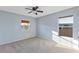Light blue bedroom with ceiling fan and carpet flooring at 11113 Scenic Vista Dr, Clermont, FL 34711