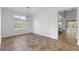 Bright dining room with tile floors and modern light fixture at 11113 Scenic Vista Dr, Clermont, FL 34711