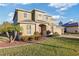 Two-story house with a red door, landscaping, and a paved driveway at 11113 Scenic Vista Dr, Clermont, FL 34711