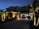 Two-story house exterior with lighting at night at 11113 Scenic Vista Dr, Clermont, FL 34711