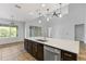Modern kitchen featuring a large island, stainless steel appliances, and pendant lighting at 11113 Scenic Vista Dr, Clermont, FL 34711