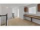 Loft area with built-in desk and carpet flooring at 11113 Scenic Vista Dr, Clermont, FL 34711