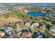 Aerial view of neighborhood with lake nearby at 11113 Scenic Vista Dr, Clermont, FL 34711